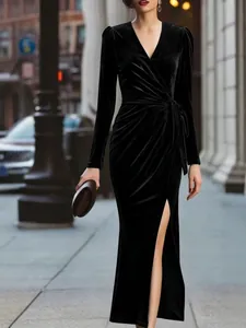 Elegant black deep V-neck velvet maxi dress featuring long sleeves and sexy side slit