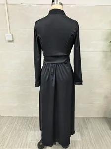 Back view detail of an elegant cinched waist black maxi dress with long sleeves design