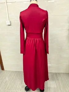 Detailed back view of an elegant red long-sleeved satin maxi dress with cinched waist