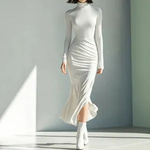 Full-body view of white high-neck pleated midi dress showing slim fit and ruched texture