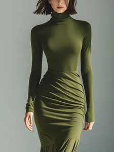 Close-up of olive green turtleneck dress featuring elegant ruched waist detailing.