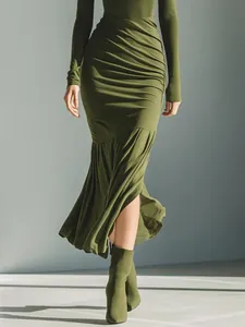 Close-up detail of olive green ruched midi dress featuring high neck and front split design