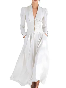 Elegant white V-neck puff sleeve maxi dress with button waist and flowing skirt.