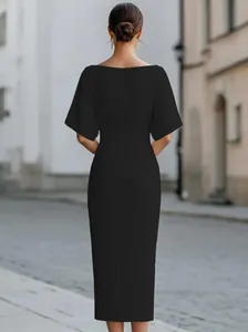 Detail of the back view of an elegant solid black mid-sleeve casual women's dress