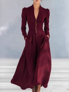 Elegant burgundy V-neck maxi dress with puff sleeves and cinched waist for formal events