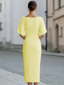 Elegant light yellow short sleeve midi dress for women, back view showing zip