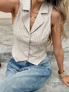 Detailed shot of a chic pinstripe sleeveless vest with lapel collar and buttons.