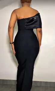 Elegant black one-shoulder bandage maxi dress shown from the back for evening wear.