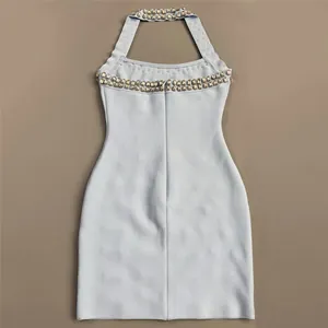 Detailed view of the light blue halter neck dress with sparkling rhinestone embellishments