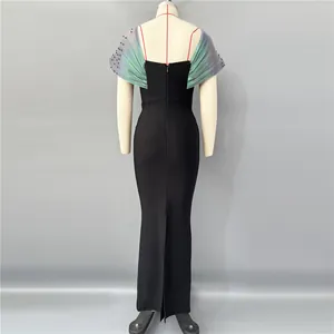 Back view of elegant black bodycon evening dress with iridescent beaded shawl sleeves