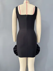 Rear view of black bandage mini dress featuring ruffled side accents on mannequin