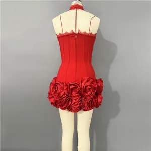 Detailed back view of a sexy red bandage mini dress with large 3D rose flower hem