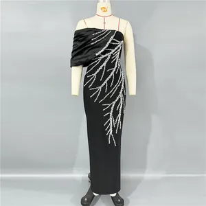 Detail view of black bodycon evening dress featuring elegant silver rhinestone branch pattern