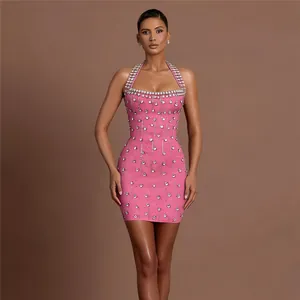 Sexy pink halter neck bandage mini dress with crystal embellishments and backless design.