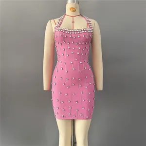 Elegant pink halter bandage mini dress featuring sparkling rhinestones for party wear.