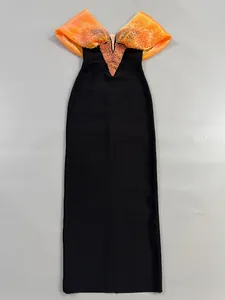 Detailed view showing the orange beaded off-the-shoulder neckline on a black bandage dress