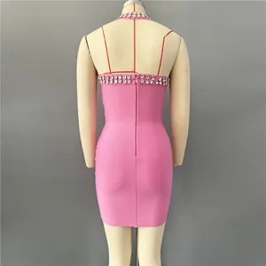 Back view of pink halter bandage mini dress with sparkling rhinestone details and zipper