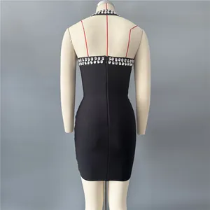 Back view of black halter bandage dress with rhinestone detailing on a mannequin
