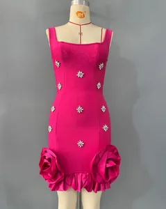 Detailed view of fuchsia bandage dress with crystal flowers and 3D rose ruffles.