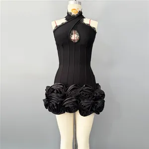 Detailed view of black bodycon dress with lace halter neck and rose flower hem