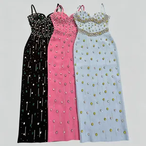Elegant evening dresses in black, pink, and blue featuring intricate rhinestone patterns