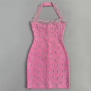 Detailed view of a pink halter bandage dress featuring elegant rhinestone embellishments