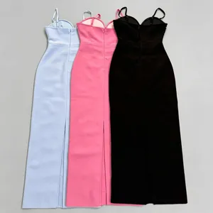 Back view of bodycon bandage maxi dresses in light blue, pink, and black with high slits