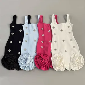 Detail view of four colorful bandage dresses with rhinestones and fabric roses