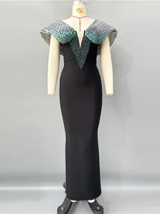 Elegant black bandage evening dress with green beaded V-neck and ruffled shoulders