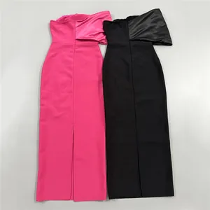 Detailed flat lay view of strapless bandage evening dresses in hot pink and black colors