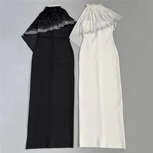 Elegant black and white evening dresses with sparkling rhinestone cape and long bandage skirt