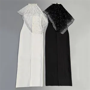Elegant black and white evening gowns featuring exquisite rhinestone embellished capes