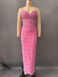 Elegant pink bandage dress with sparkling rhinestones and bodycon fit for evening parties