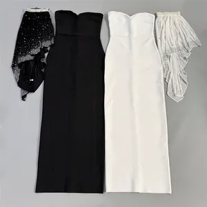 High-definition detail view of rhinestone capes and elegant strapless bandage evening gowns