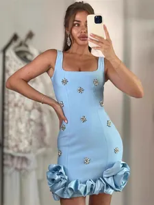 Elegant light blue sexy bodycon bandage dress featuring rhinestone flowers and ruffled hemline