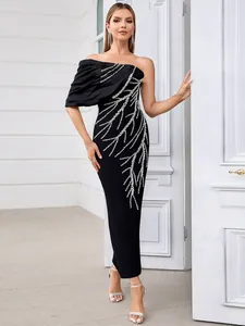 Elegant black one-shoulder bandage evening gown with sparkling silver rhinestone patterns.
