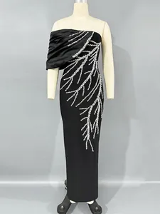 Elegant black bandage evening gown with one-shoulder design and rhinestone branch motifs