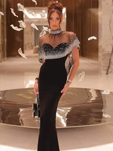 Elegant black evening gown with a luxurious rhinestone shawl perfect for formal banquets