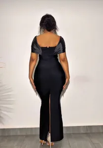Back view of a sexy black off-the-shoulder bandage evening gown with floor length