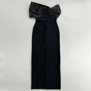 Elegant black off-shoulder bandage long dress featuring a large decorative bow-knot