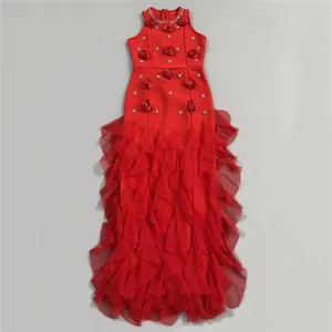 Elegant red evening gown with 3D floral appliqués and tiered ruffled skirt detail