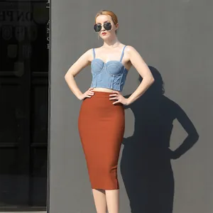 Full view of elegant orange high-waisted bandage skirt with slimming bodycon fit