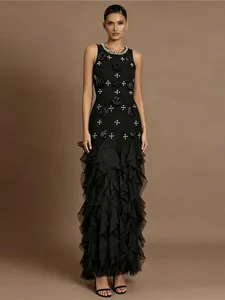 Elegant vintage black evening gown with 3D floral accents and tiered ruffled skirt