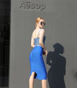 Back view of a blue high-waisted bodycon pencil skirt with zipper and slit detail