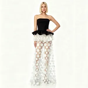 Elegant strapless bandage evening gown with black bodice and white polka dot sheer skirt