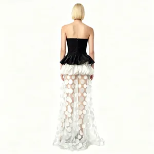 Elegant back view of black strapless evening gown with white 3D polka dot mesh skirt