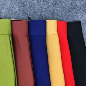 Detailed macro view of colorful high-waist elastic bandage skirts in multiple solid shades