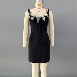 Detailed view of a sexy black bodycon mini dress with elegant crystal embellishments