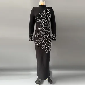 Elegant black long-sleeved bandage maxi dress featuring intricate white floral beadwork