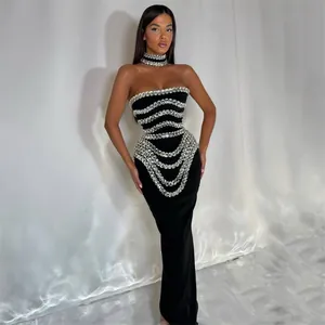 Elegant black strapless evening gown with intricate rhinestone patterns and a slim fit